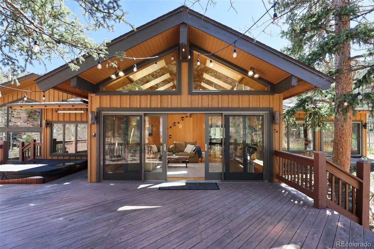 Front exterior of a two-story home with siding and brick accents
