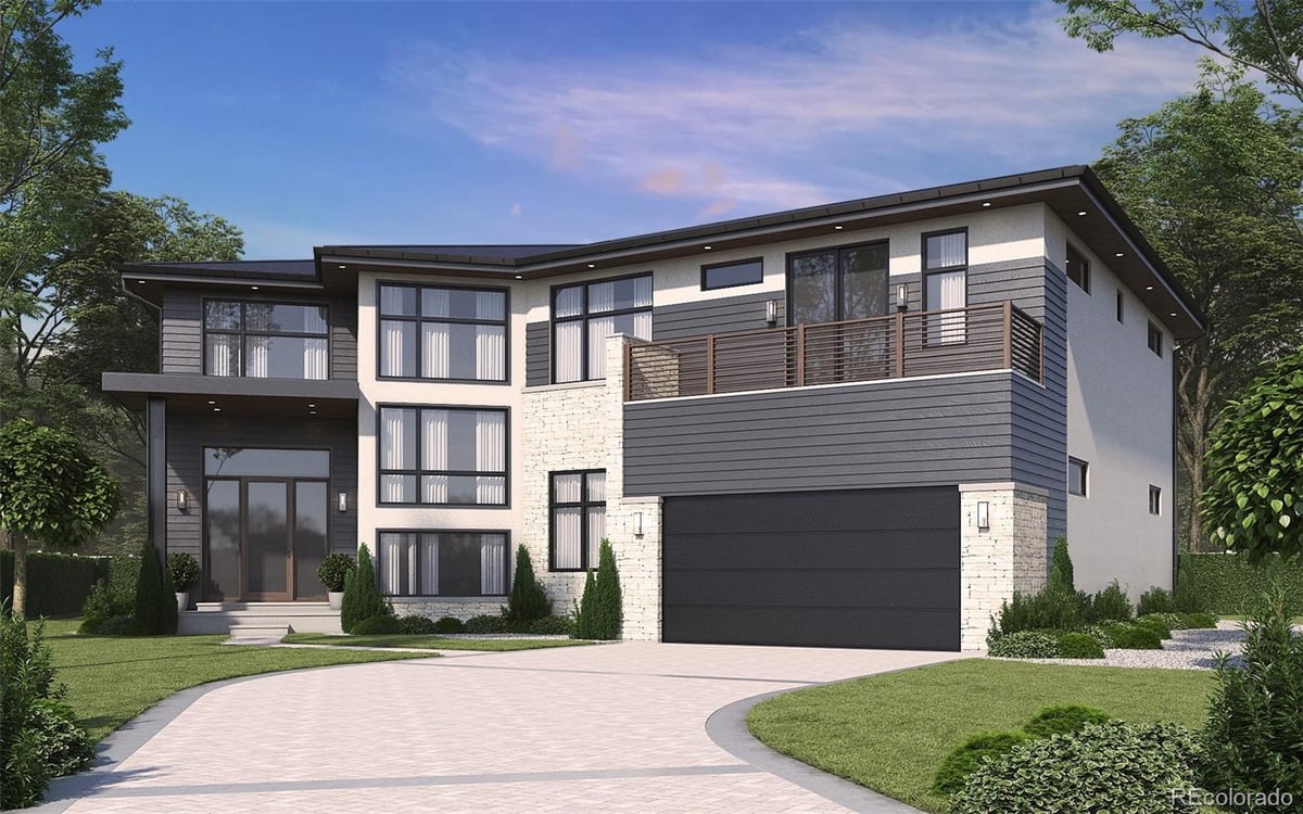 Front exterior of a two-story home with siding and brick accents